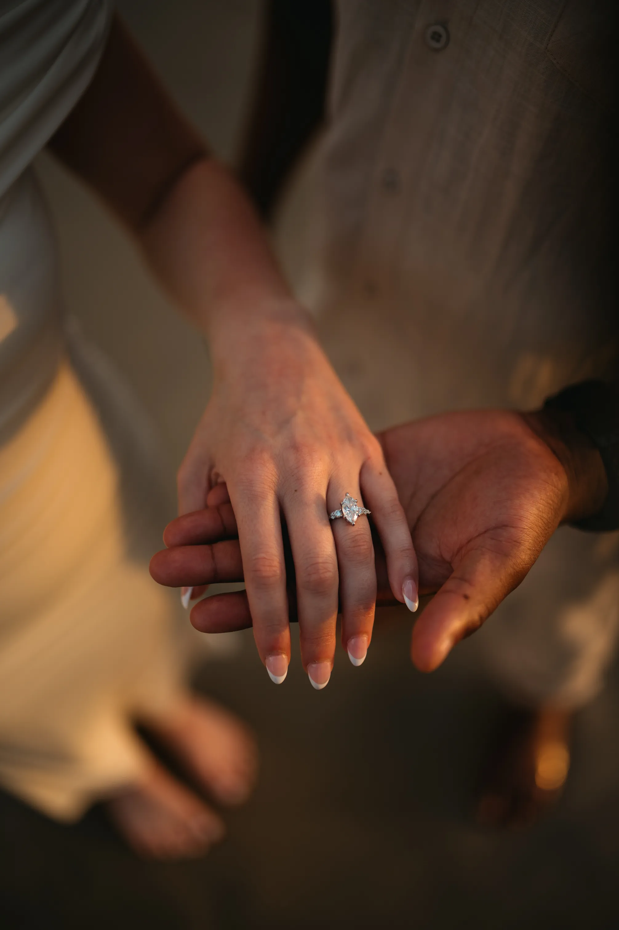 Yohance and Christina holding hands, engagement photo